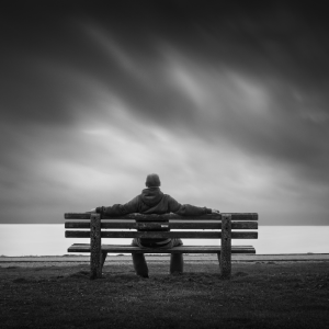 man-waiting-on-bench